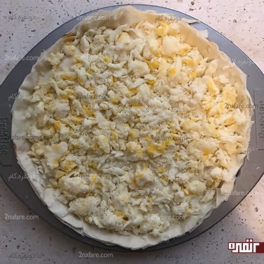 اضافه کردن پنیر پیتزا