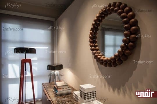 آینه ای خاص و زیبا با قاب چوبی برای تزیین فضا
